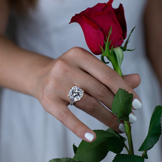 12-carat cushion-cut D color diamond ring with a solitaire halo design, ideal for luxury engagement and timeless elegance.