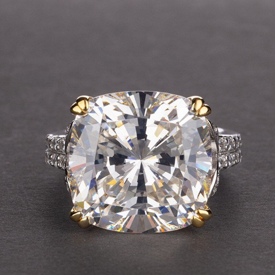 12-carat cushion-cut D color diamond ring with a solitaire halo design, ideal for luxury engagement and timeless elegance.