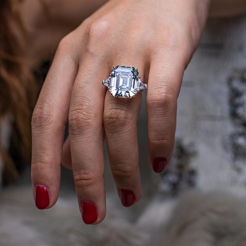 3-carat emerald-cut D-color diamond three-stone ring, luxury wedding or engagement jewelry with timeless elegance.