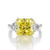 4-carat brilliant princess cut canary yellow diamond ring with three-stone halo design, ideal for weddings and luxury engagements.
