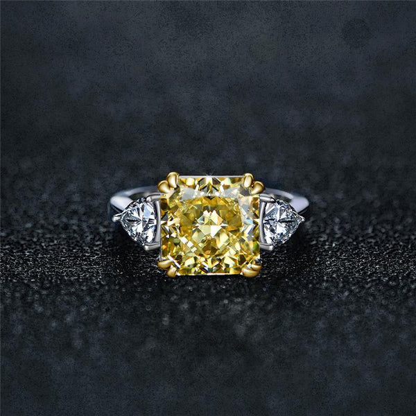 4-carat brilliant princess cut canary yellow diamond ring with three-stone halo design, ideal for weddings and luxury engagements.