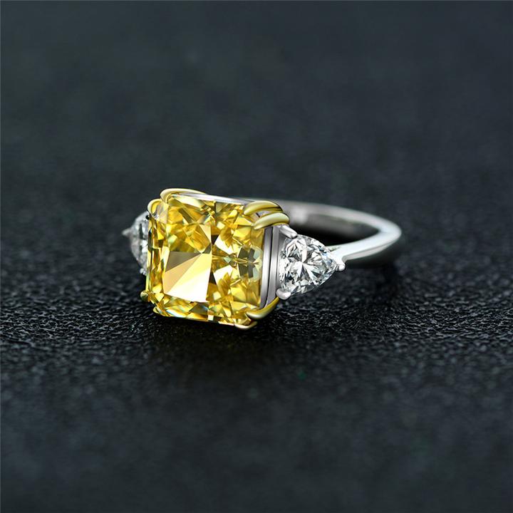 4-carat brilliant princess cut canary yellow diamond ring with three-stone halo design, ideal for weddings and luxury engagements.