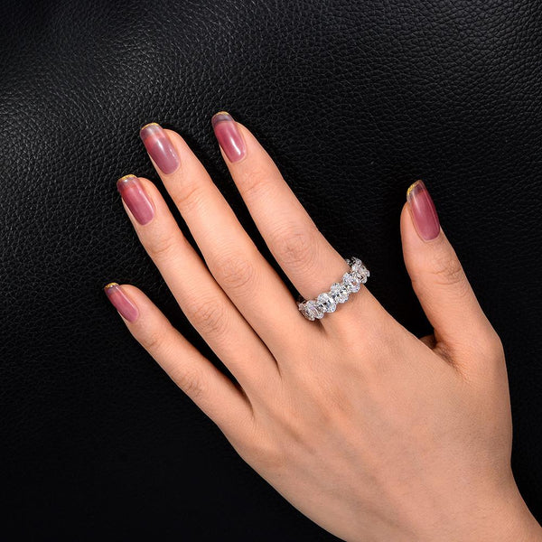 4-carat brilliant Oval Cut D color Lab-Grown diamond eternity ring. A minimalist eternity design perfect for luxurious engagements.