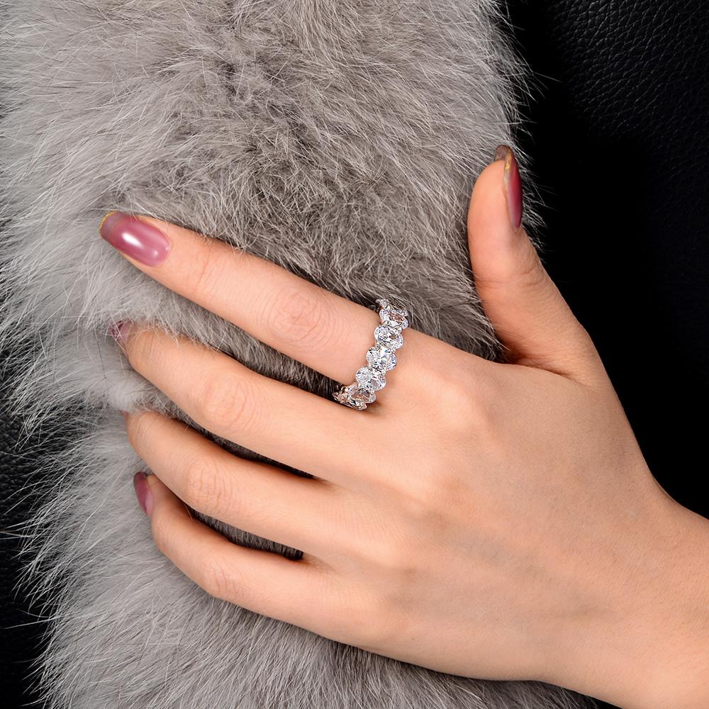 4-carat brilliant Oval Cut D color Lab-Grown diamond eternity ring. A minimalist eternity design perfect for luxurious engagements.