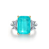 4 carat Paraiba blue three-stone ring in sterling silver and gold with an ocean-inspired design, ideal for engagements.