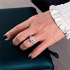 4-carat brilliant princess cut D color diamond ring with three-stone halo design, ideal for weddings and luxury engagements.
