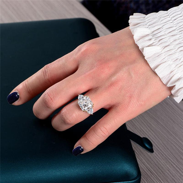 4-carat brilliant princess cut D color diamond ring with three-stone halo design, ideal for weddings and luxury engagements.