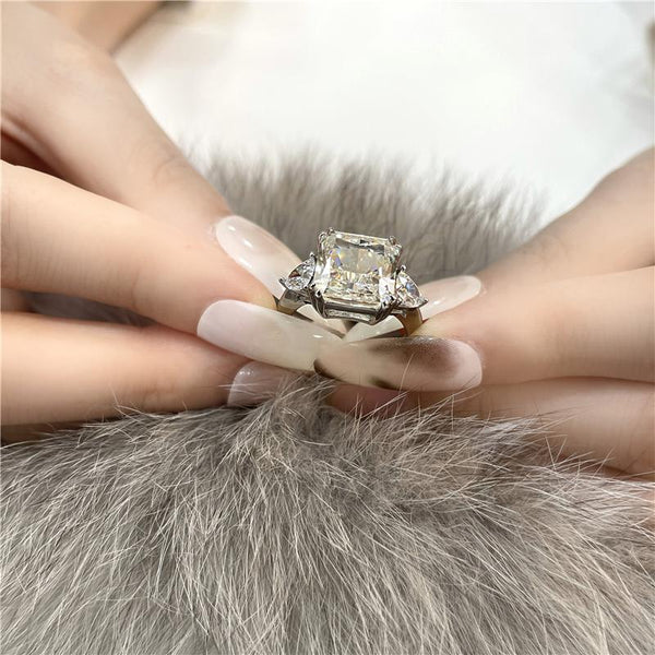 4-carat brilliant princess cut D color diamond ring with three-stone halo design, ideal for weddings and luxury engagements.