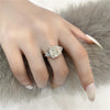 4-carat brilliant princess cut D color diamond ring with three-stone halo design, ideal for weddings and luxury engagements.