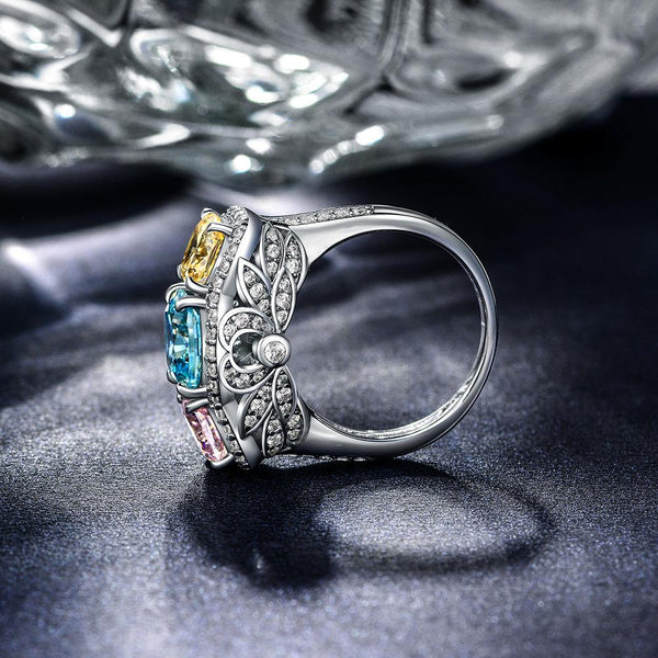 5.0 Carat Cushion-Cut Ocean-Blue Aquamarine Ring with Pink and Yellow Diamonds in a Three Stone Design on White Gold Band