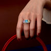 5.0 Carat Cushion-Cut Ocean-Blue Aquamarine Ring with Pink and Yellow Diamonds in a Three Stone Design on White Gold Band