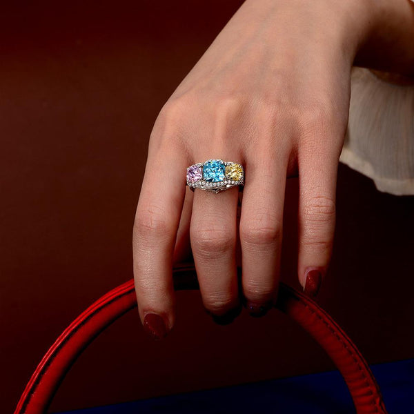 5.0 Carat Cushion-Cut Ocean-Blue Aquamarine Ring with Pink and Yellow Diamonds in a Three Stone Design on White Gold Band