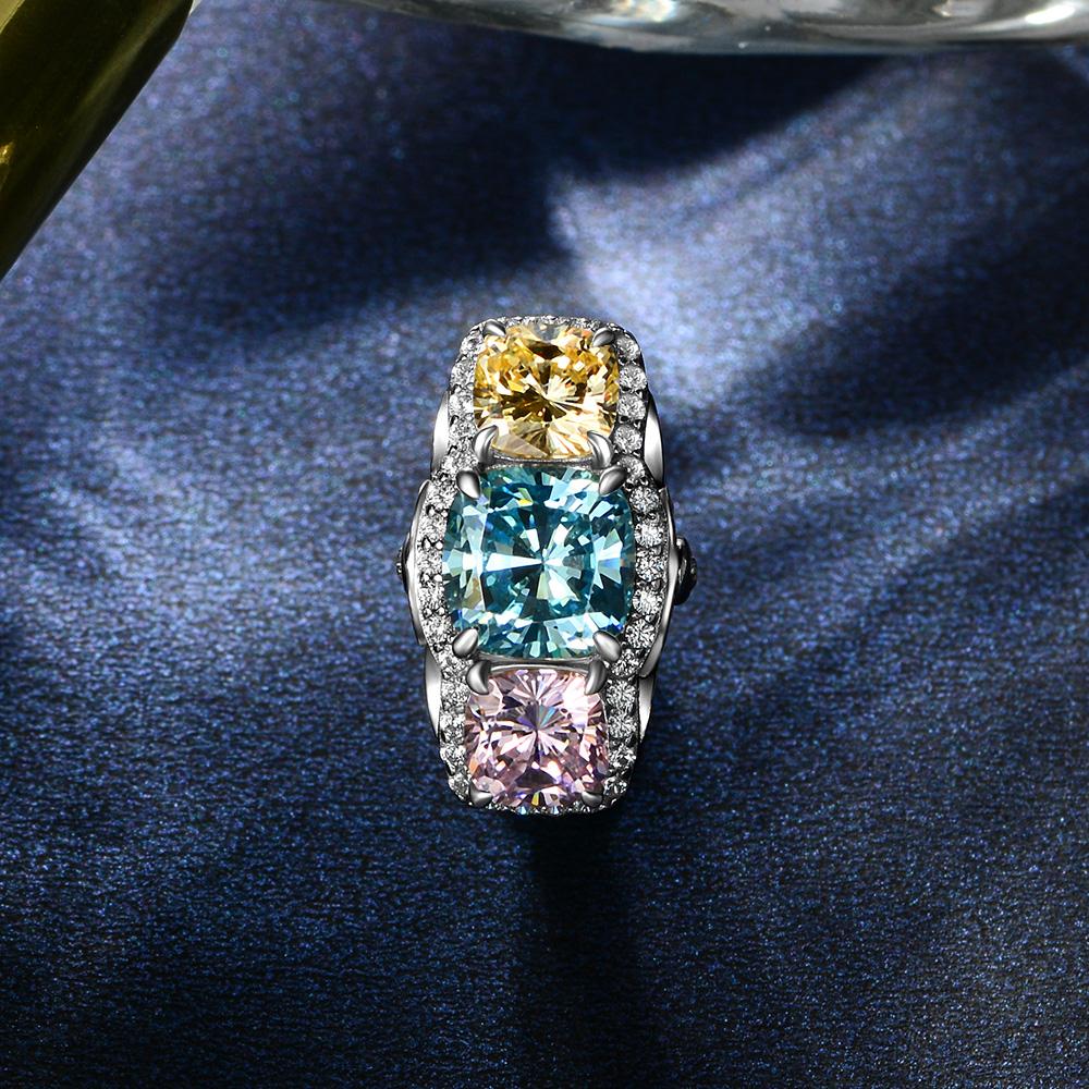 5.0 Carat Cushion-Cut Ocean-Blue Aquamarine Ring with Pink and Yellow Diamonds in a Three Stone Design on White Gold Band