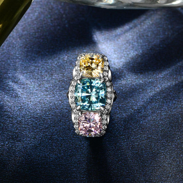 5.0 Carat Cushion-Cut Ocean-Blue Aquamarine Ring with Pink and Yellow Diamonds in a Three Stone Design on White Gold Band
