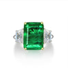 Green Emerald Halo Ring with vivid emerald cut stone, surrounded by a sparkling three stone, perfect for engagements and anniversary