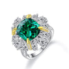 5 carat green emerald halo ring in 925 sterling silver with a vivid green gemstone centerpiece, perfect for engagement and luxury occasions.