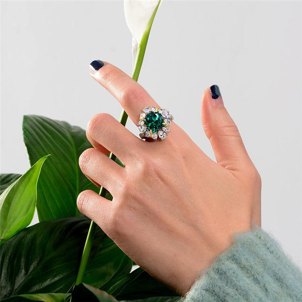 5 carat green emerald halo ring in 925 sterling silver with a vivid green gemstone centerpiece, perfect for engagement and luxury occasions.