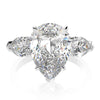 6-carat D color brilliant pear-cut diamond ring with a three-stone design, perfect for weddings and engagements, crafted for ultimate luxury.