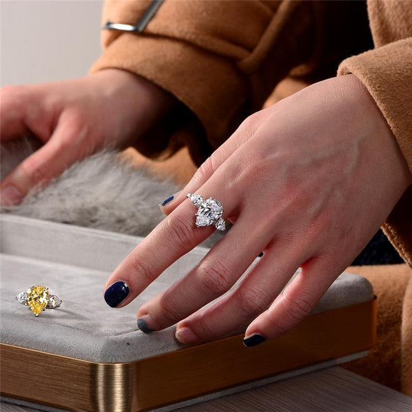 6-carat D color brilliant pear-cut diamond ring with a three-stone design, perfect for weddings and engagements, crafted for ultimate luxury.