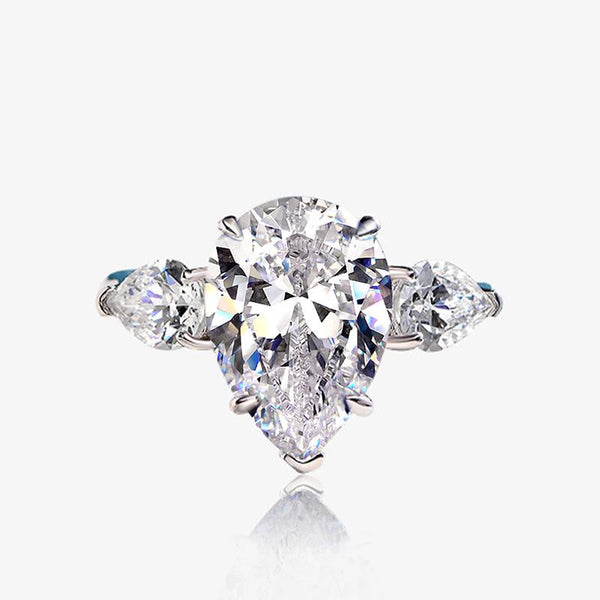 6-carat D color brilliant pear-cut diamond ring with a three-stone design, perfect for weddings and engagements, crafted for ultimate luxury.