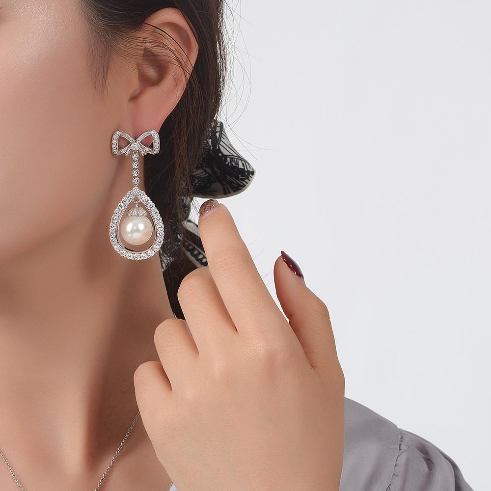 Long Tassel Love Bow Style Mother of Pearl Dangle Earring w Luxurious Design
