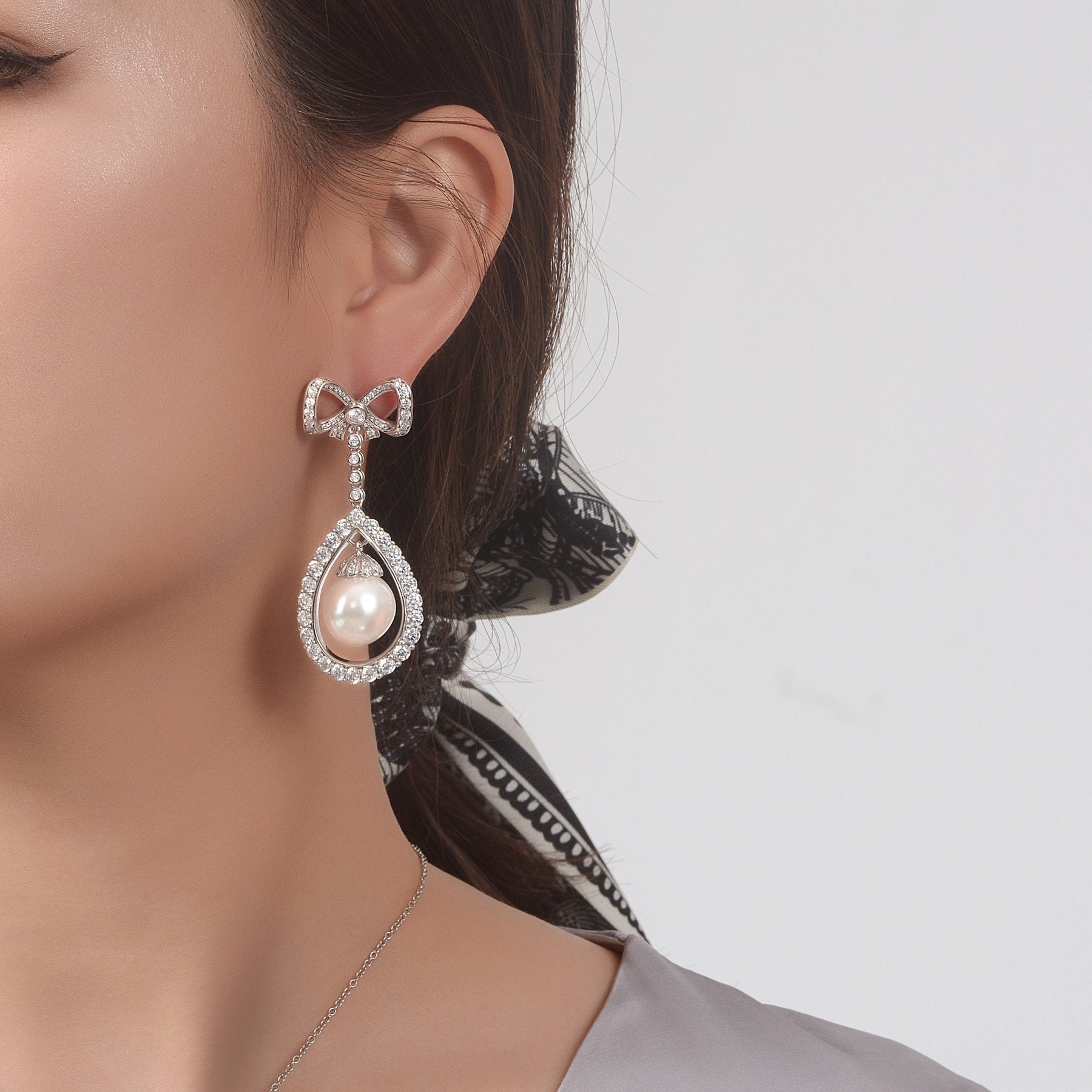 Long Tassel Love Bow Style Mother of Pearl Dangle Earring w Luxurious Design