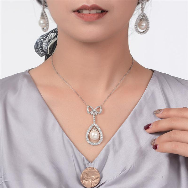 Long Tassel Love Bow Style Mother of Pearl Dangle Pendant w Luxurious Design